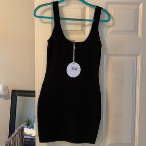 New with tags. Black ribbed body con dress. Size S/M. Princess Polly.
